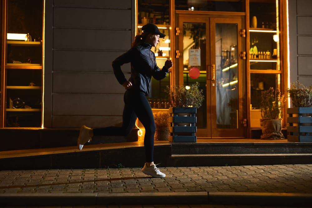 YoungGood-lookingSportswomanIsRunningInNightCityAtStreets - SomethingBeautiful!!