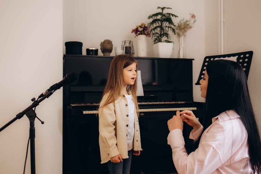 VocalSchoolAWomanTeachesALittleGirlToSing - SomethingBeautiful!!