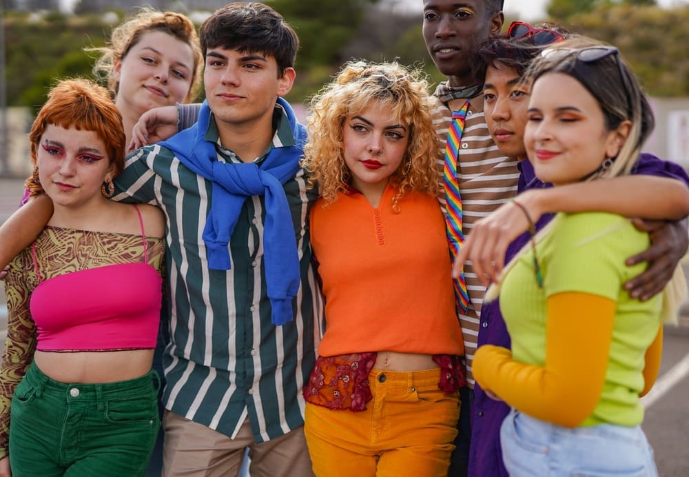 GroupOfMultiracialYoungPeopleHuggingEachOtherOutdoor - SomethingBeautiful!!