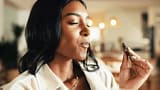 home-woman-eating-chocolate-candy-250nw-2585087203 - SomethingBeautiful!!