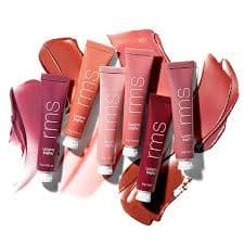 ダウンロード 11 - SomethingBeautiful!! Set of six colorful lip gloss tubes arranged together, showing pink, coral, and red shades.