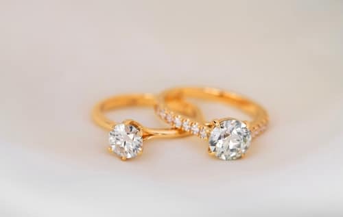 TwoYellowGoldRingsWithADiamondsInTheMiddle - SomethingBeautiful!!
