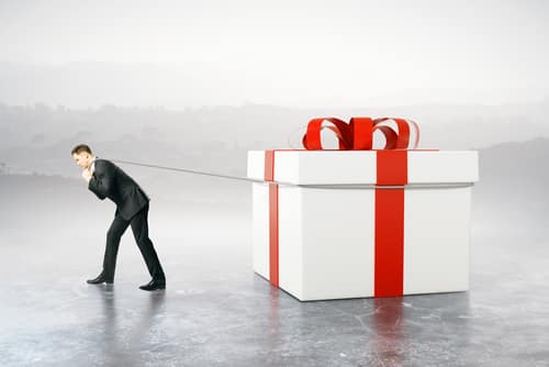 BusinessmanDraggingHugePresentBoxOnAbstractBackground3dRendering - SomethingBeautiful!!